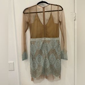 Beautiful cocktail dress with delicates transparency